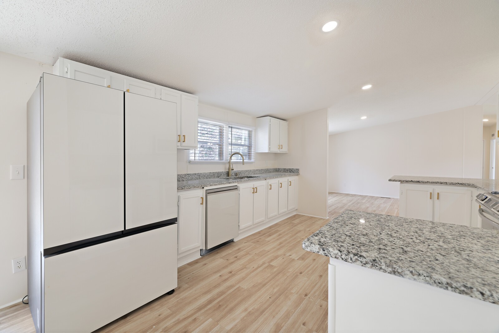 462 Pole Hill Road Goodlettsville, TN 37072 - Photo 17 of 41 a kitchen with white cabinets and white appliances