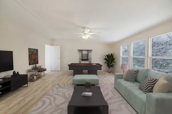 a living room with furniture and a window