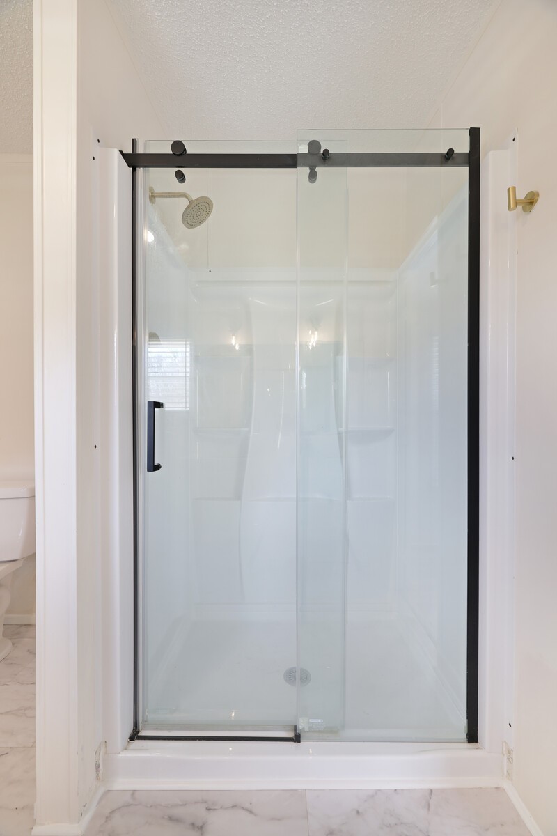 462 Pole Hill Road Goodlettsville, TN 37072 - Photo 29 of 41 a bathroom with a glass shower door
