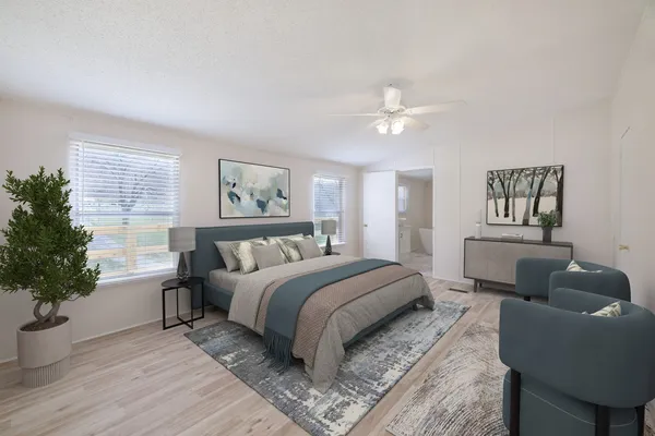 a bedroom with a large bed and a couch