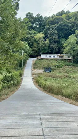 a aerial view of a house with a yard