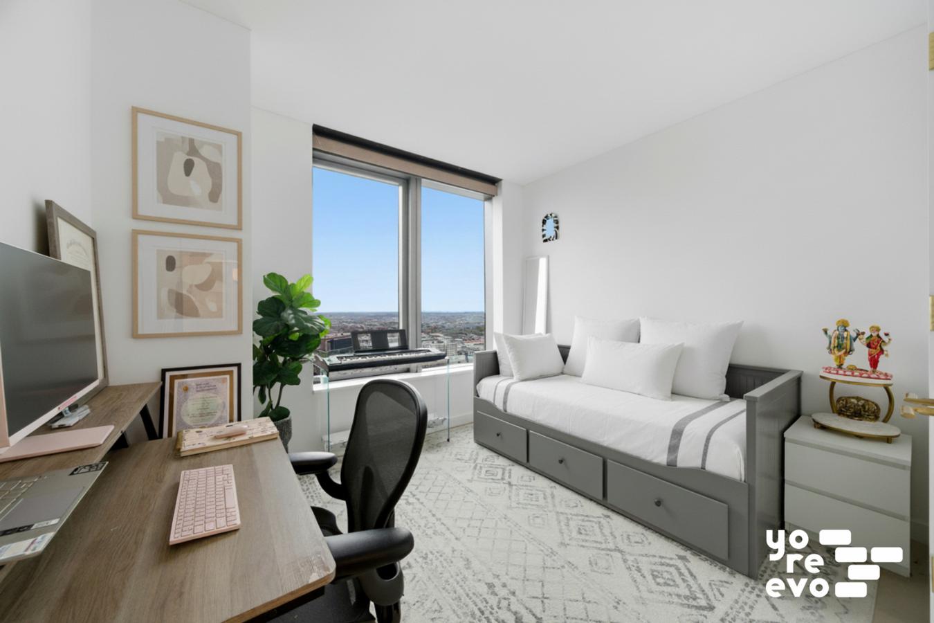 3 Court Square, Unit 4308 Queens, NY 11101 - Photo 12 of 13 a bedroom with a bed and a chair