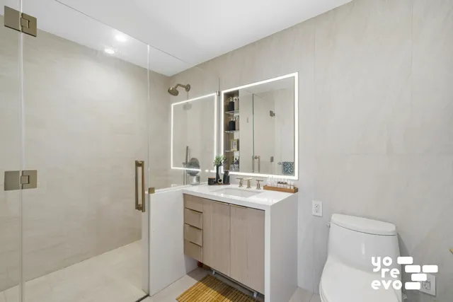 a bedroom with a bed and a potted plant