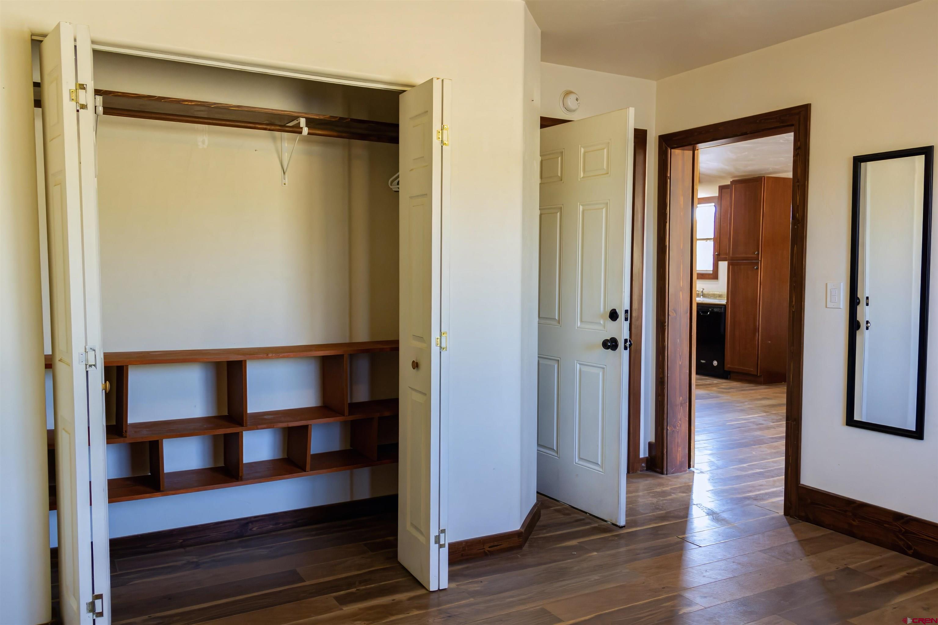 320 County Road 329 Ignacio, CO 81137 - Photo 11 of 45 a view of a hallway with wooden floor and closet