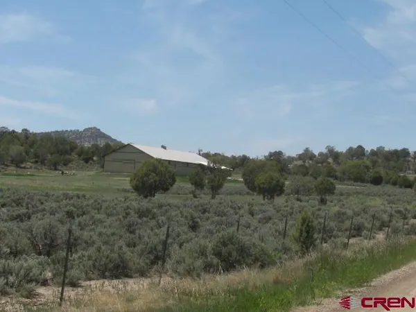 a view of a lake with a big yard