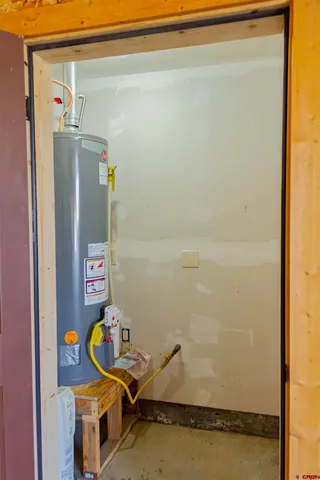 an entryway and livingroom with furniture