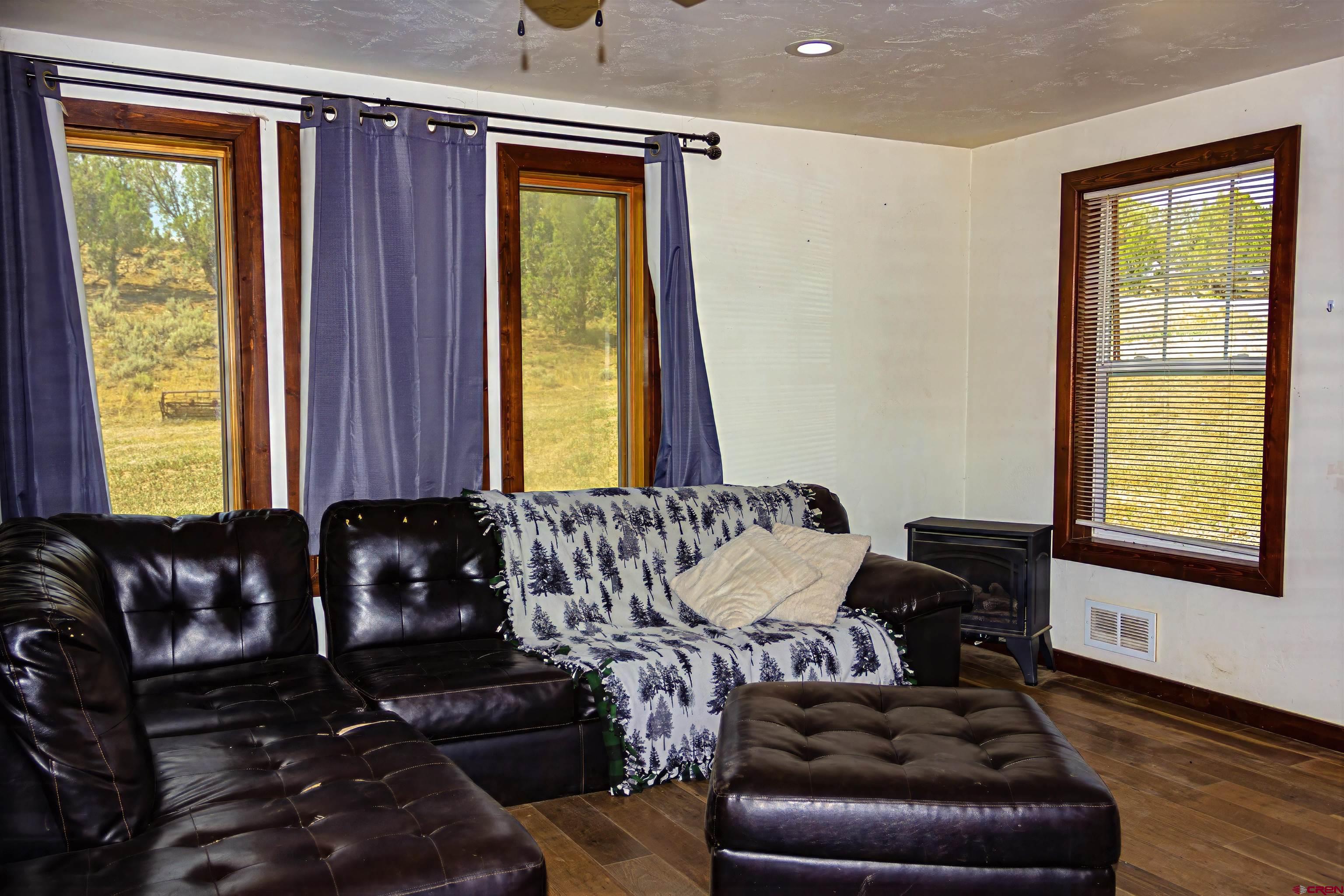 320 County Road 329 Ignacio, CO 81137 - Photo 9 of 45 a living room with furniture and a window