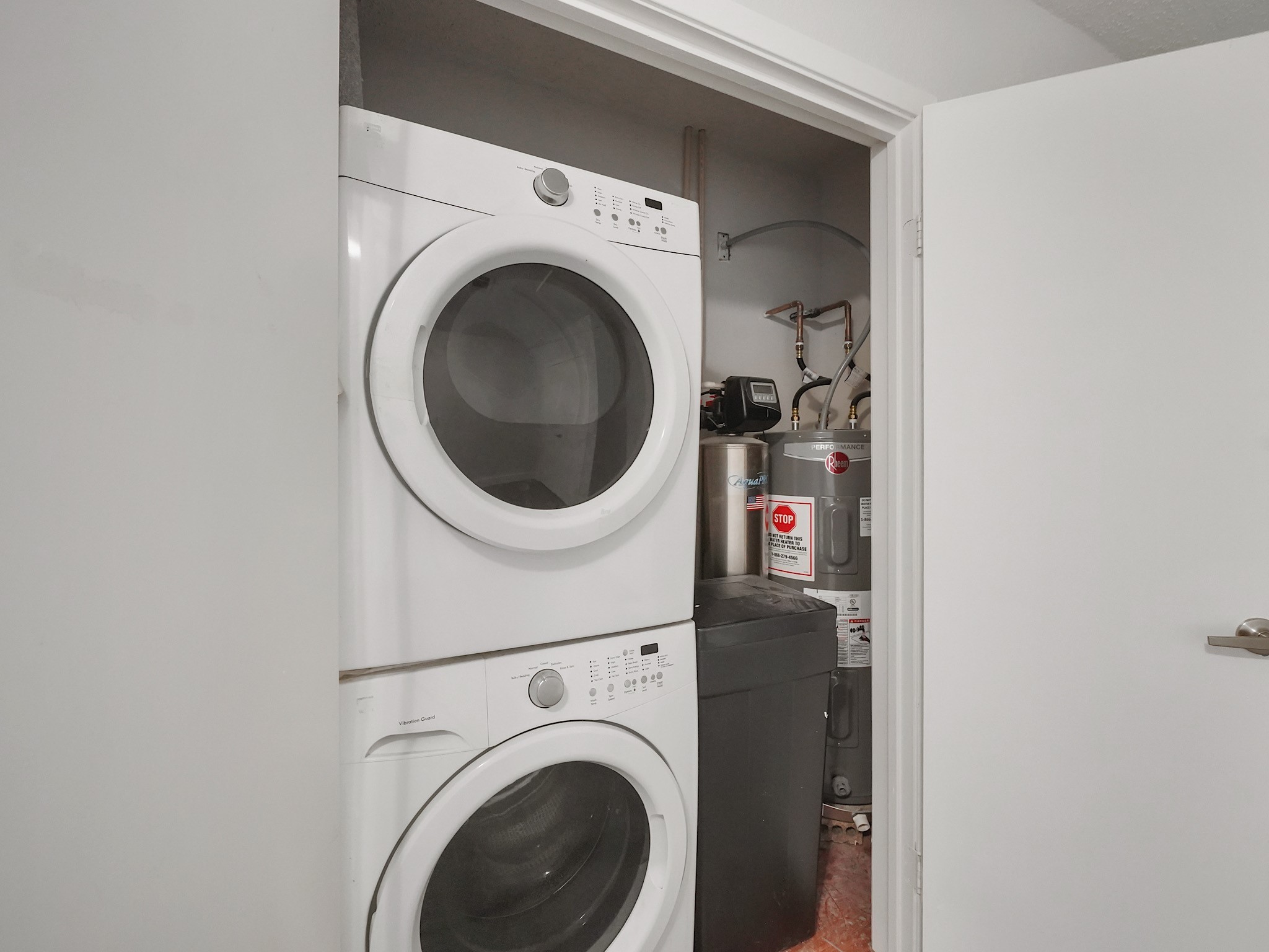 23338 Prairie Bird Drive Spring, TX 77373 - Photo 15 of 18 a close up view of a washer and dryer