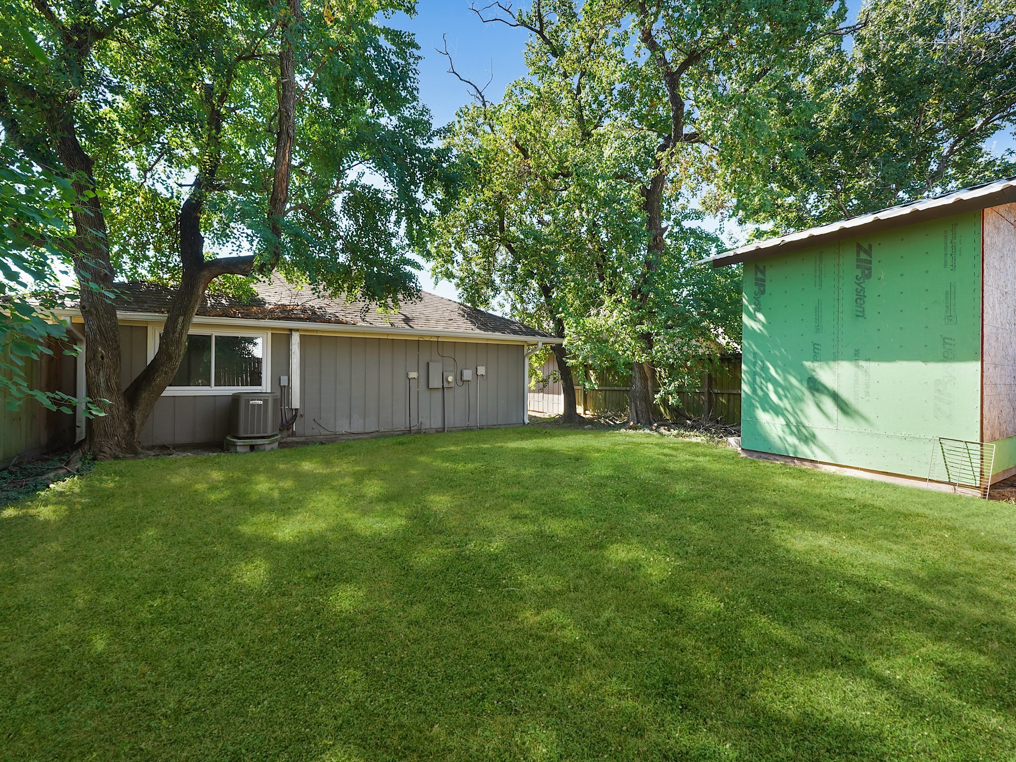 23338 Prairie Bird Drive Spring, TX 77373 - Photo 16 of 18 a view of a backyard with a barn and large trees