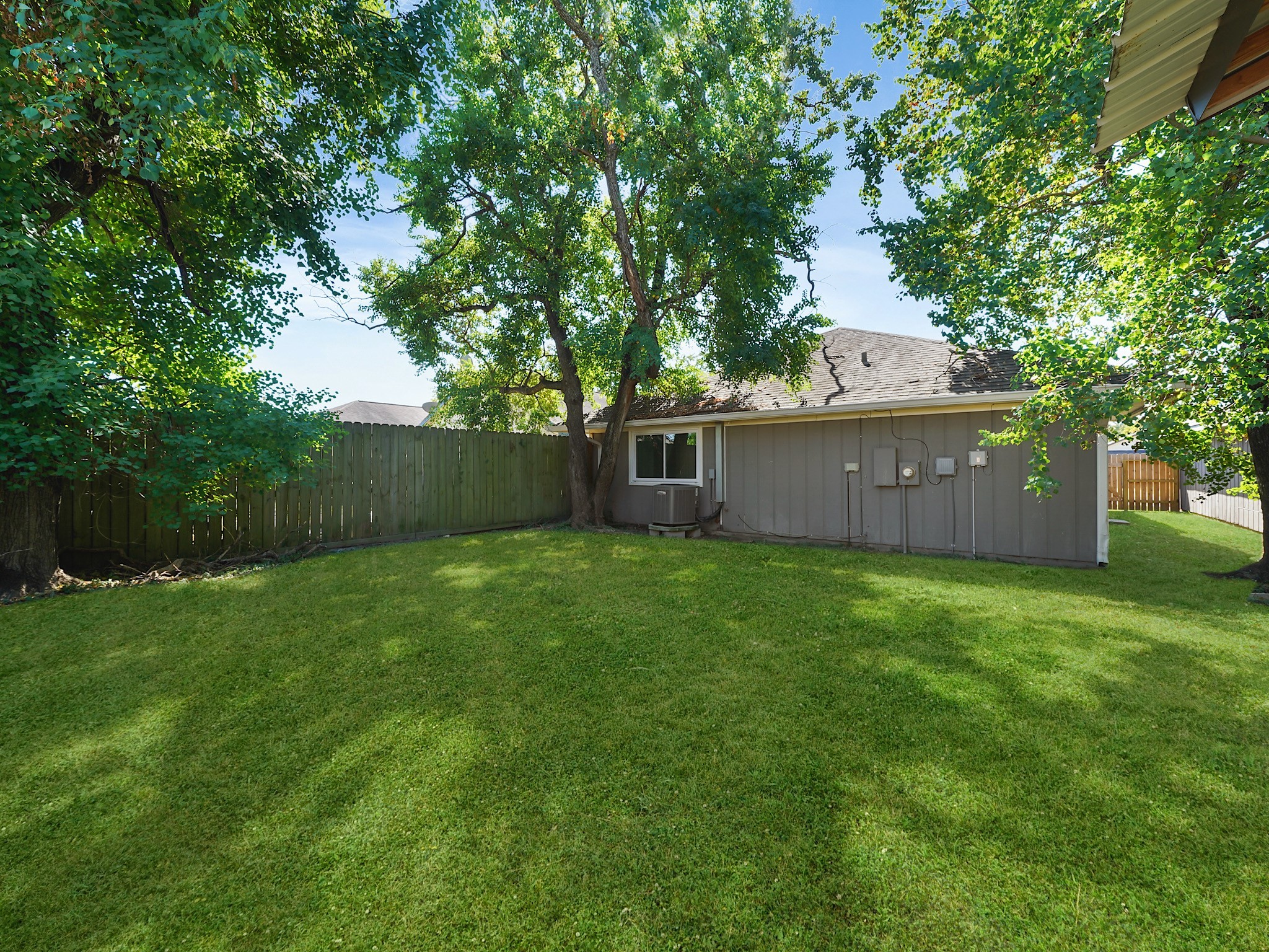 23338 Prairie Bird Drive Spring, TX 77373 - Photo 17 of 18 a view of a backyard with a garden and trees