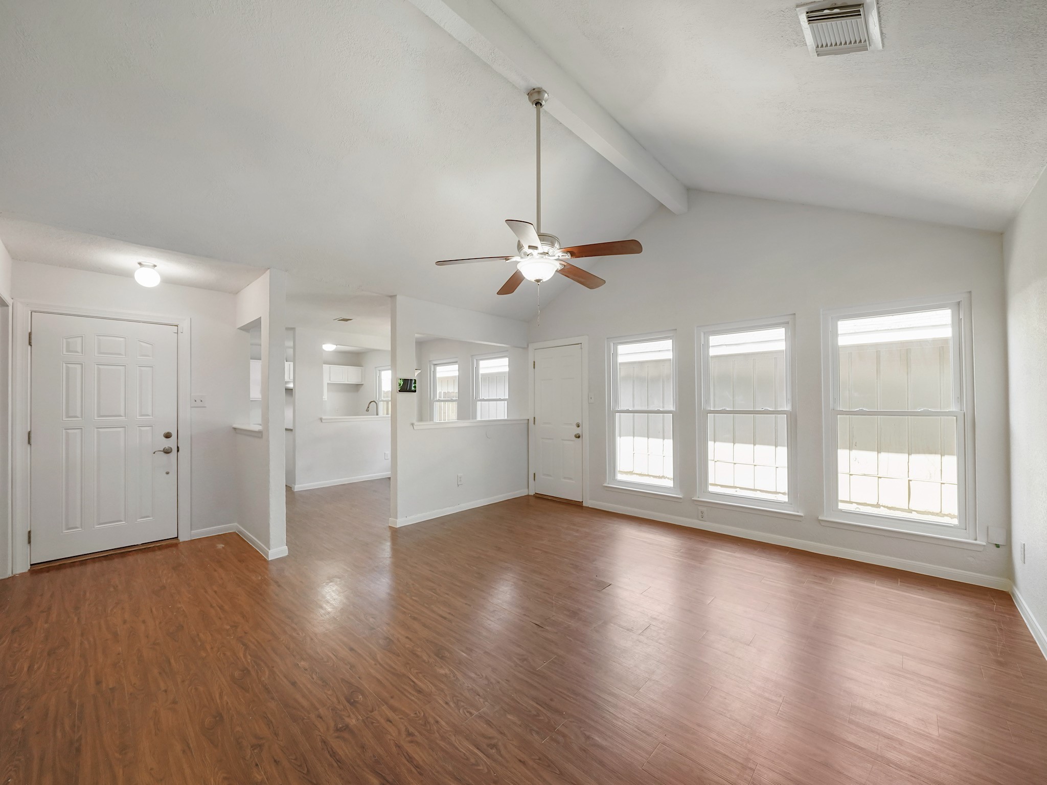23338 Prairie Bird Drive Spring, TX 77373 - Photo 3 of 18 a view of an empty room with wooden floor and a window