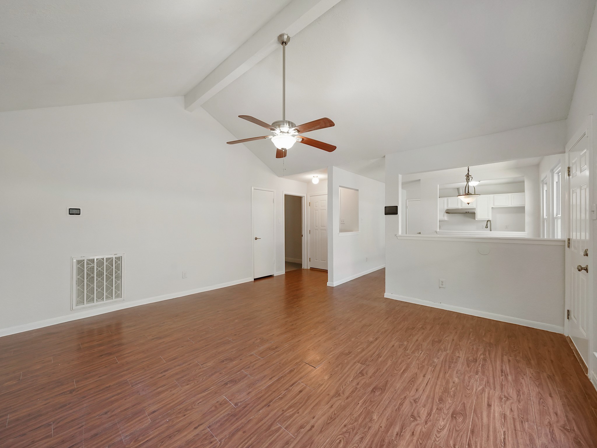 23338 Prairie Bird Drive Spring, TX 77373 - Photo 4 of 18 a view of a room with wooden floor and white walls