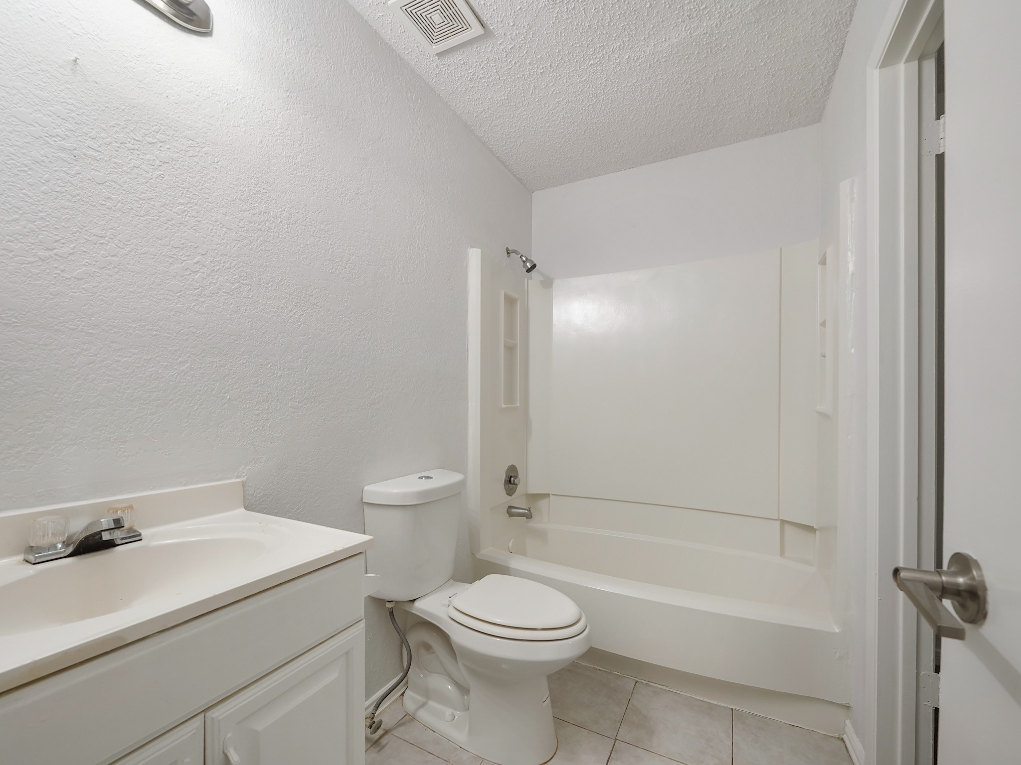 23338 Prairie Bird Drive Spring, TX 77373 - Photo 10 of 18 a bathroom with a sink toilet and shower