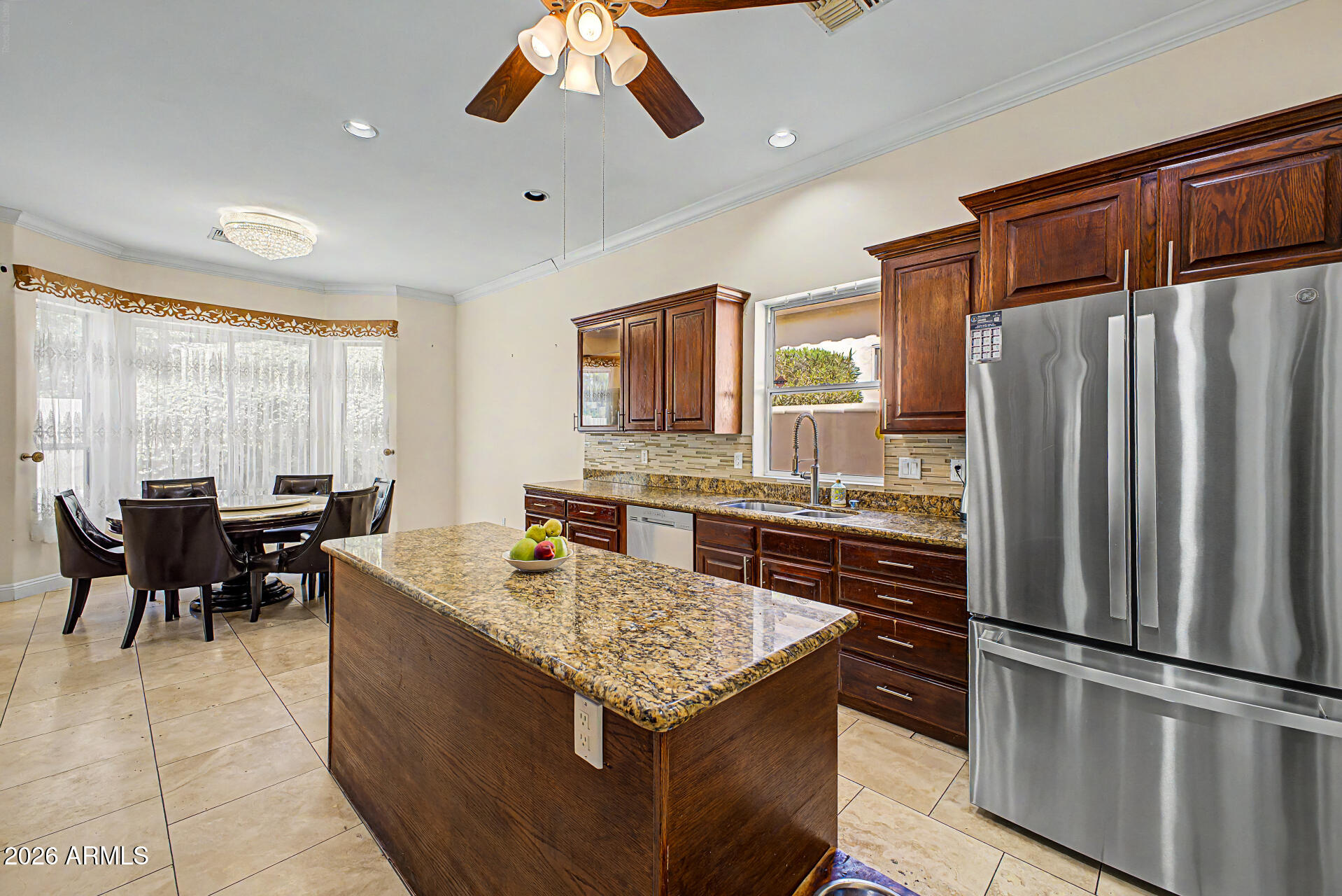 808 West Citrus Way Phoenix, AZ 85013 - Photo 11 of 35 a kitchen with stainless steel appliances granite countertop a refrigerator a stove a sink a dining table and chairs with wooden floor