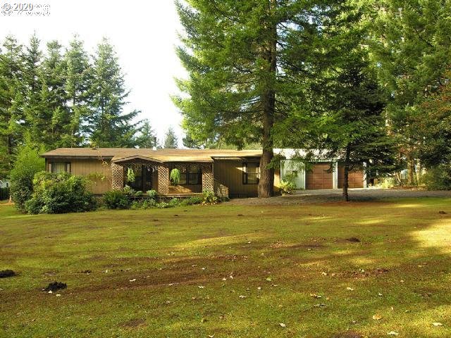 25069 South Springwater Road Estacada, OR 97023 - Photo 1 of 2 a front view of a house with a garden