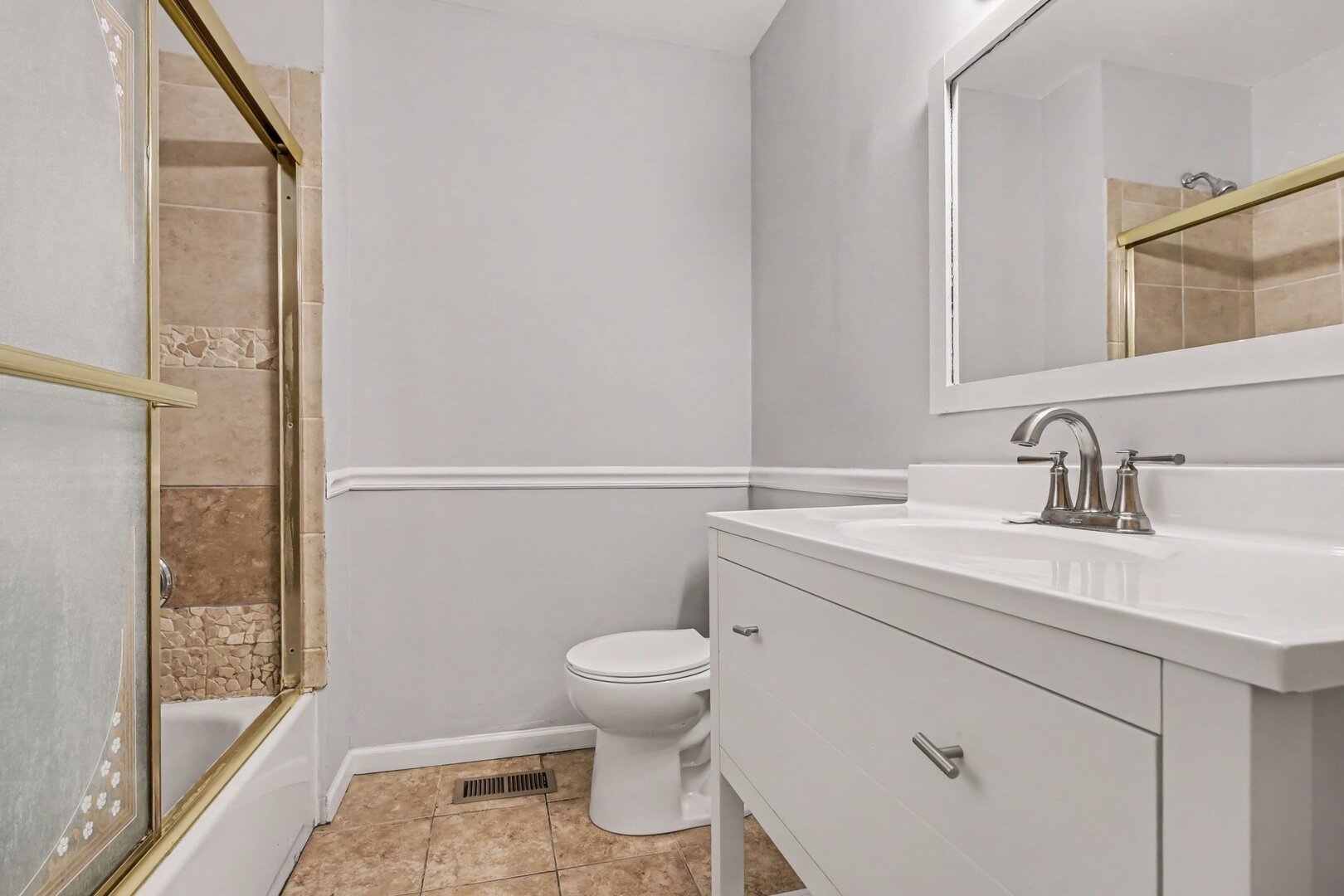 208 West Nippersink Road Round Lake, IL 60073 - Photo 10 of 18 a bathroom with a sink a toilet and shower