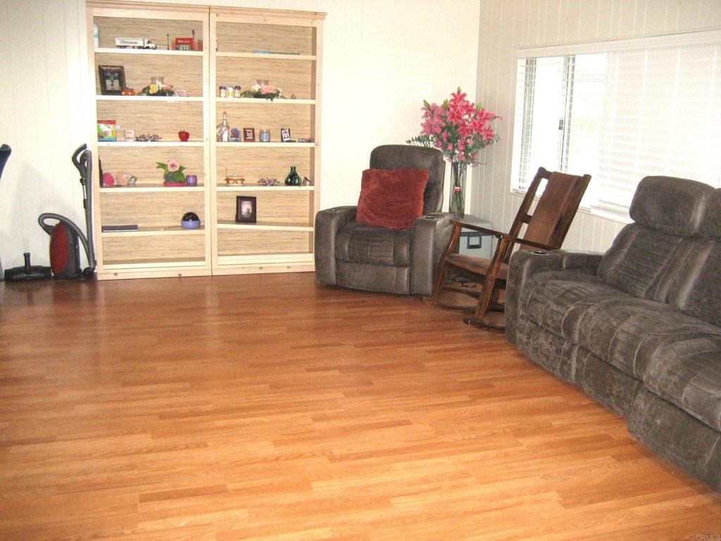 1175 La Moree Road, Unit 33 San Marcos, CA 92078 - Photo 11 of 18 a room with furniture and wooden floor