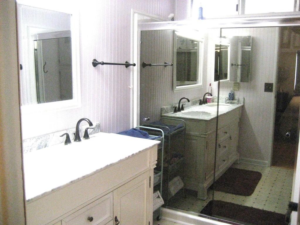 1175 La Moree Road, Unit 33 San Marcos, CA 92078 - Photo 13 of 18 a bathroom with a sink and mirror with toilet