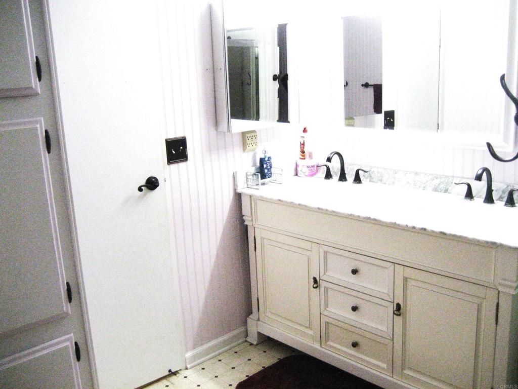 1175 La Moree Road, Unit 33 San Marcos, CA 92078 - Photo 14 of 18 a bathroom with a sink and a mirror