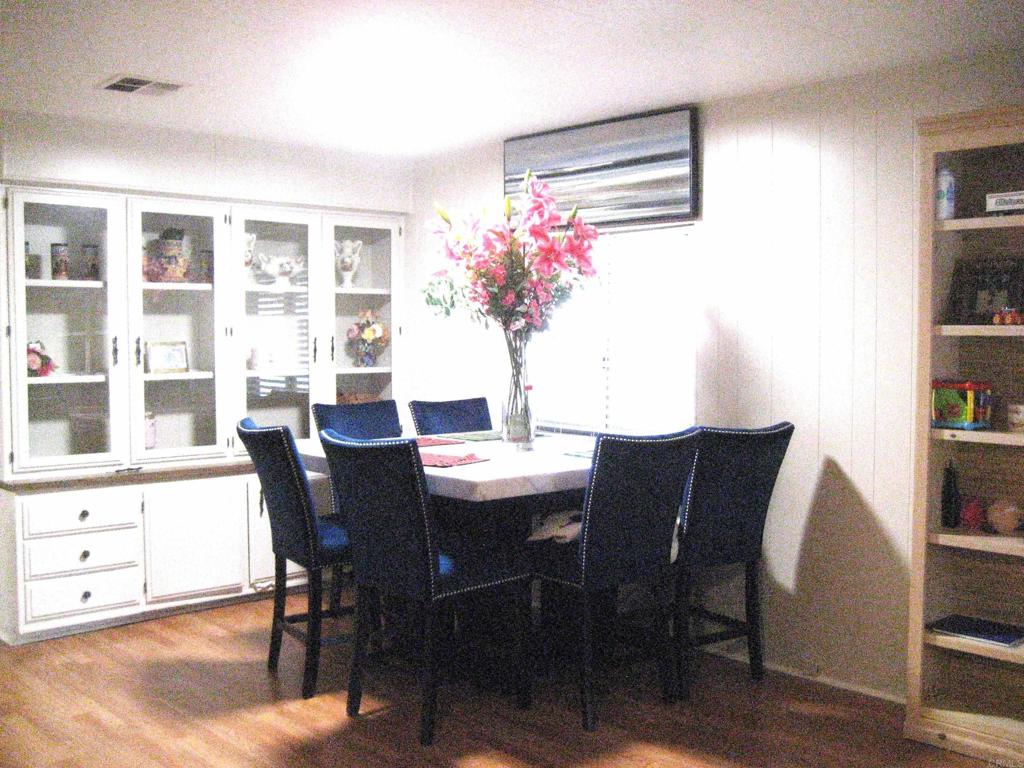 1175 La Moree Road, Unit 33 San Marcos, CA 92078 - Photo 9 of 18 a view of a dining room with furniture and a potted plant