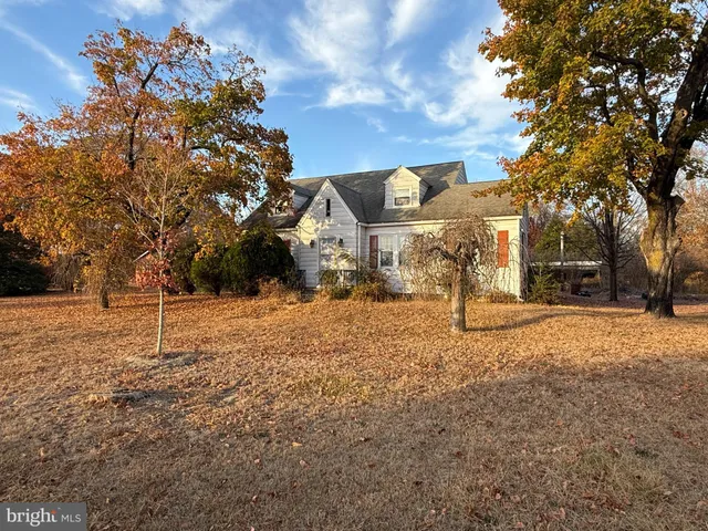 a house with trees in front of it