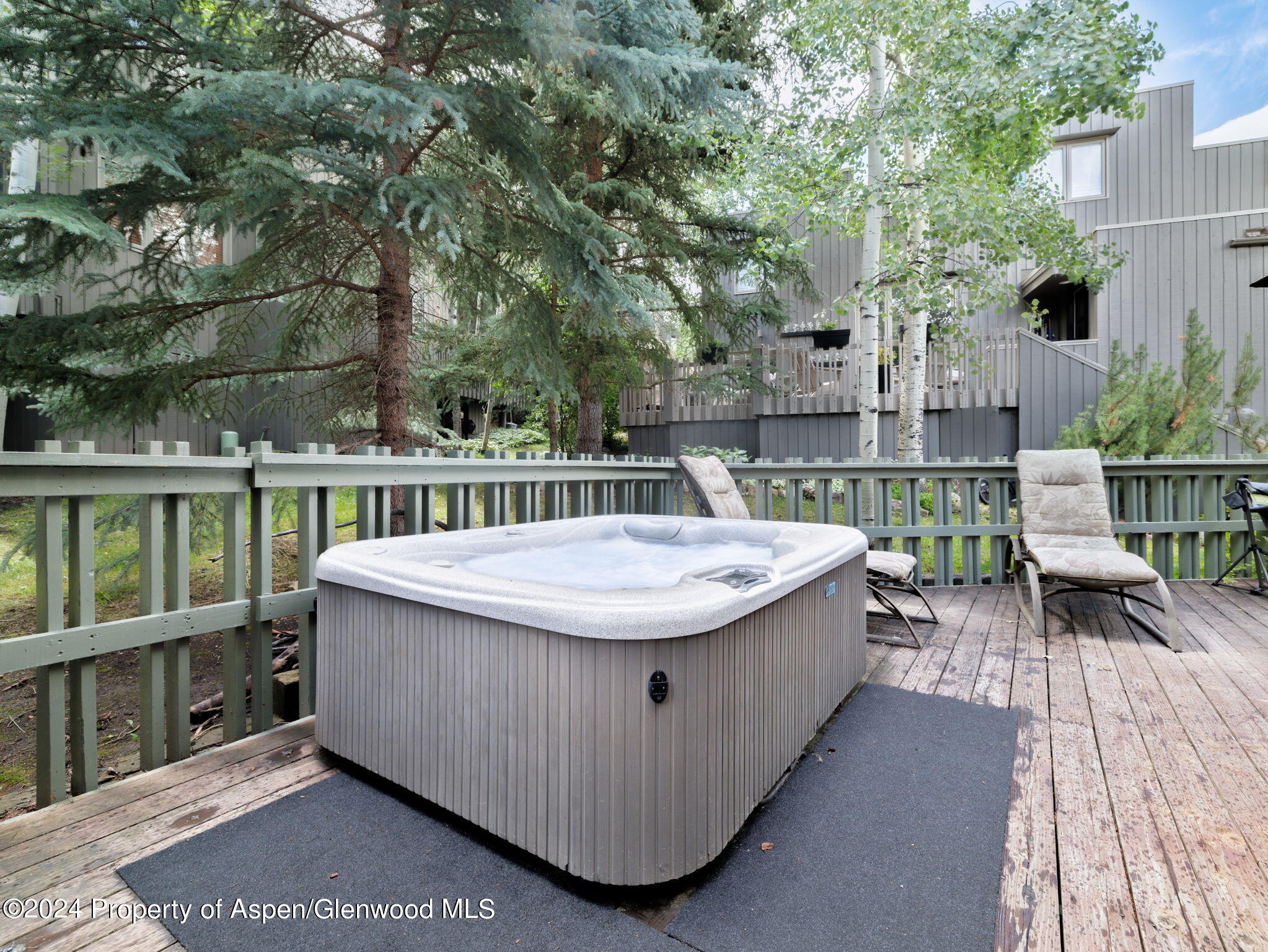 383 Meadow Ranch Road, Unit F4C Snowmass Village, CO 81615 - Photo 5 of 16 a view of a dinning table and chairs in patio of the house