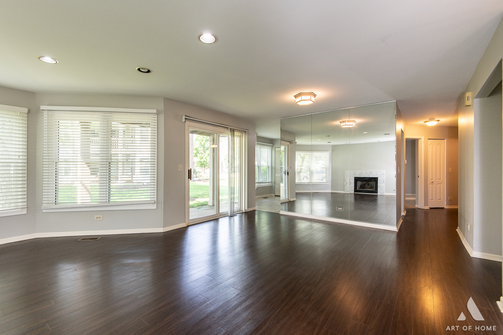 61 Willow Parkway, Unit 61 Buffalo Grove, IL 60089 - Photo 11 of 34 an empty room with wooden floor and windows