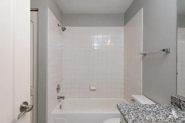 a bathroom with a shower and a toilet