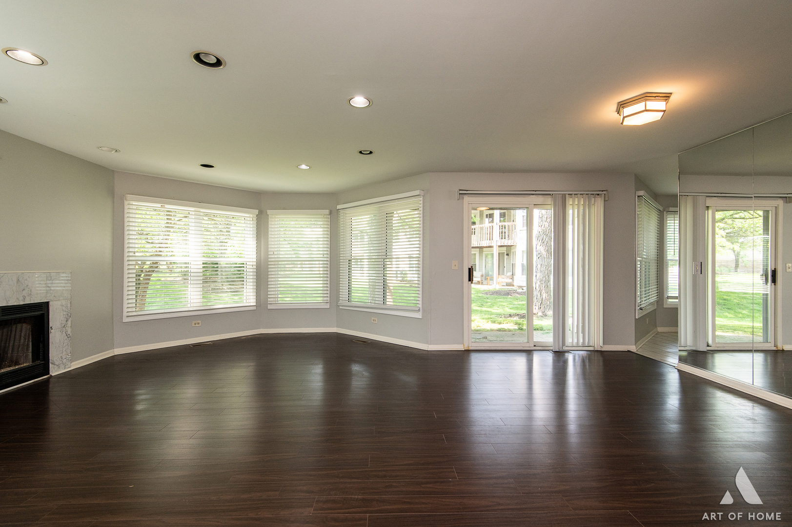61 Willow Parkway, Unit 61 Buffalo Grove, IL 60089 - Photo 6 of 34 a view of an empty room with wooden floor and a window