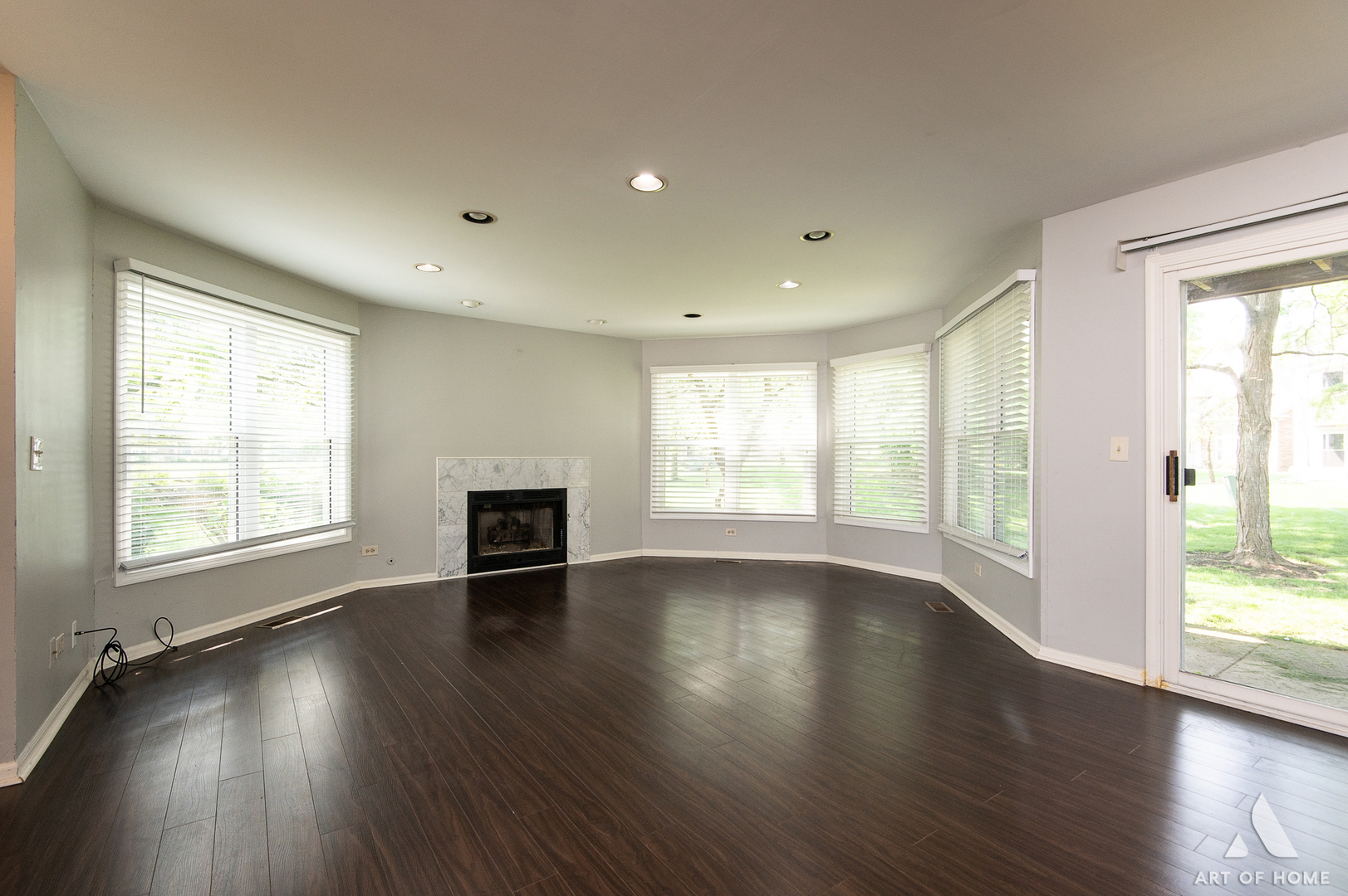 61 Willow Parkway, Unit 61 Buffalo Grove, IL 60089 - Photo 8 of 34 an empty room with wooden floor and a fireplace