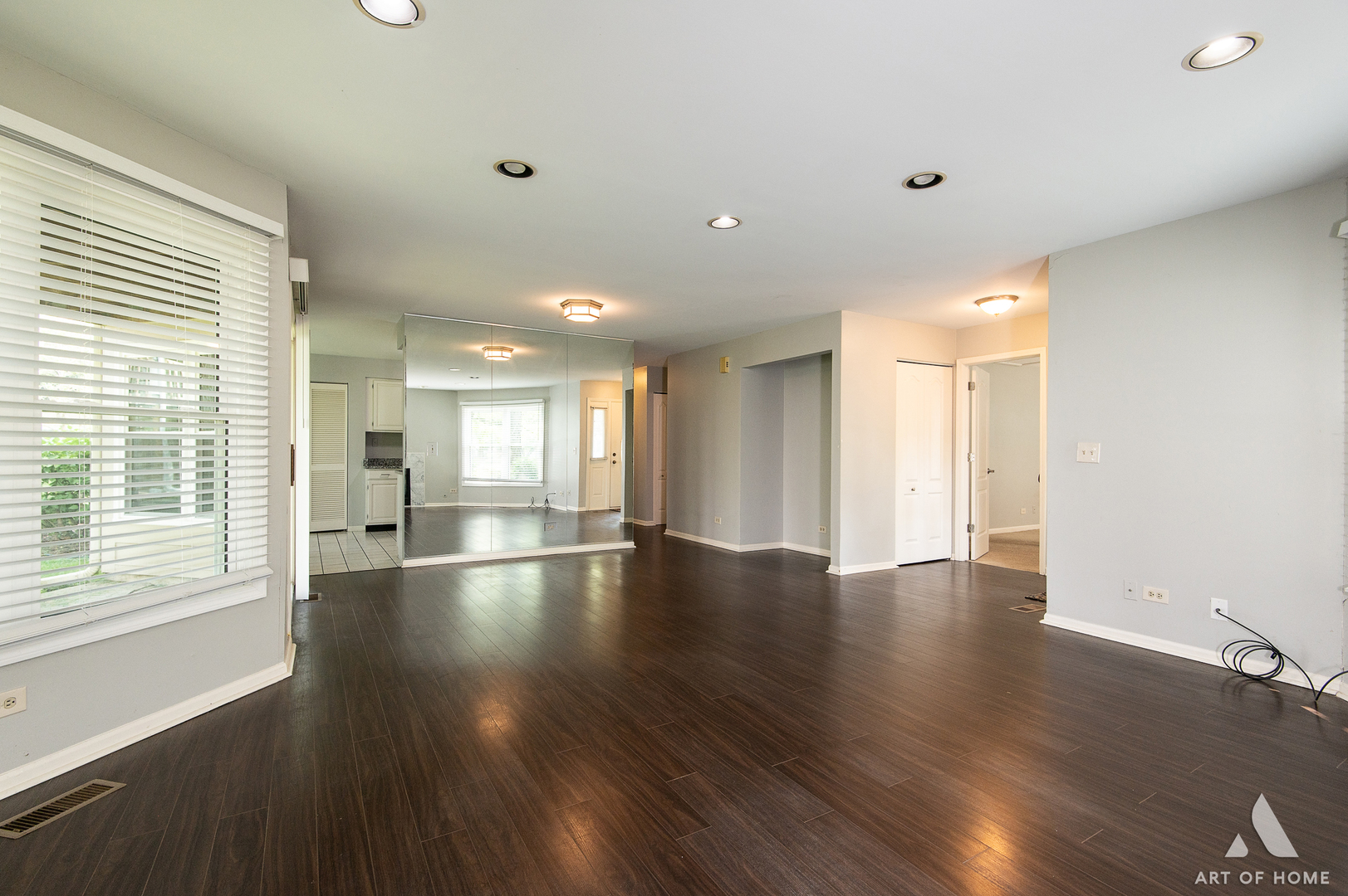 61 Willow Parkway, Unit 61 Buffalo Grove, IL 60089 - Photo 10 of 34 a view of an empty room with wooden floor and a window