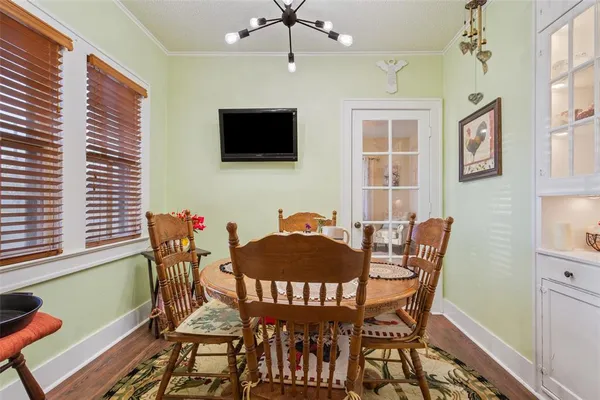 a view of a livingroom with furniture window and wooden floor