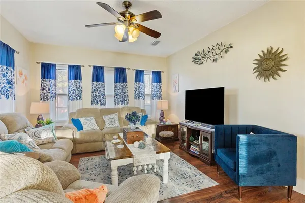 a living room with furniture and a flat screen tv