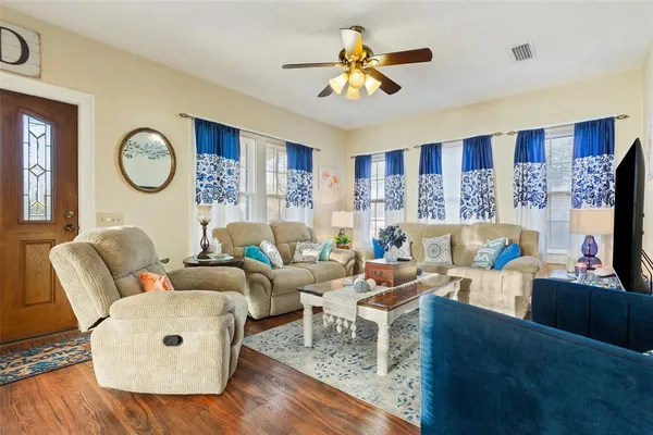 a living room with furniture and a flat screen tv