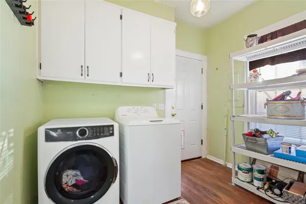 a utility room with sink dryer and washer