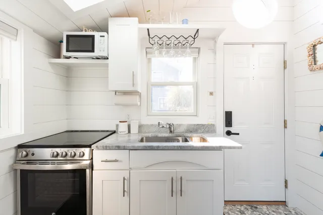 a kitchen with a stove and a microwave