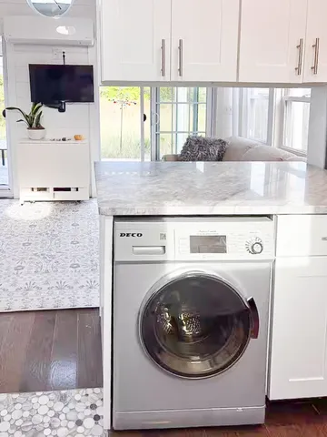 a utility room with a sink a washer and dryer