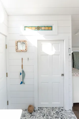 a bathroom with a shower and a sink