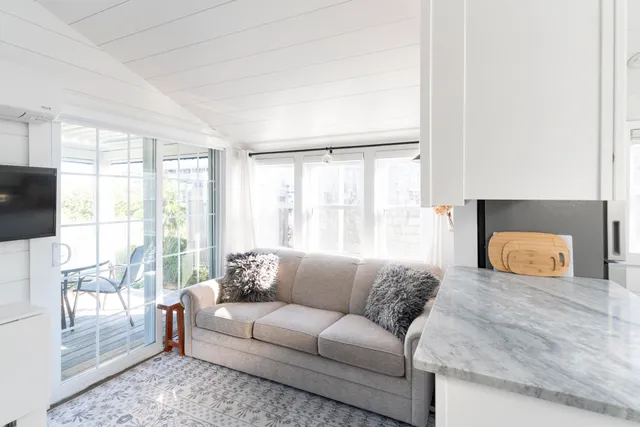 a view of a patio with a table and chairs