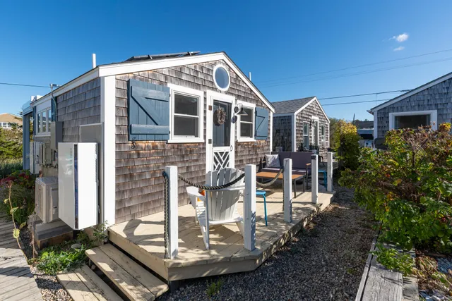 a front view of a house with a porch