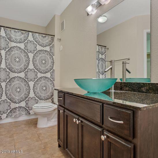 3848 North 3rd Avenue, Unit 1086 Phoenix, AZ 85013 - Photo 15 of 35 a kitchen with stainless steel appliances granite countertop a sink and a granite counter tops