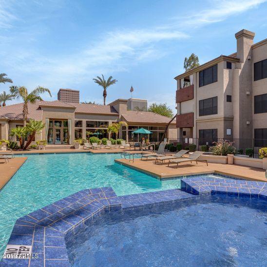 3848 North 3rd Avenue, Unit 1086 Phoenix, AZ 85013 - Photo 19 of 35 a swimming pool with outdoor seating and yard