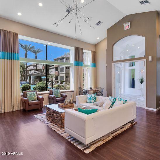 3848 North 3rd Avenue, Unit 1086 Phoenix, AZ 85013 - Photo 23 of 35 a living room with furniture and a large window