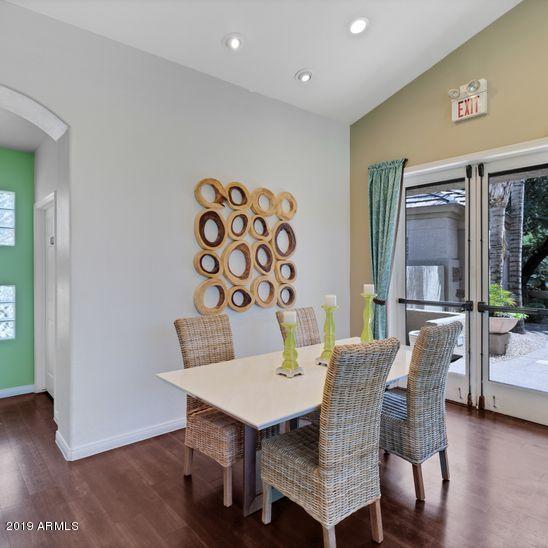 3848 North 3rd Avenue, Unit 1086 Phoenix, AZ 85013 - Photo 26 of 35 a view of a dining room with furniture and wooden floor