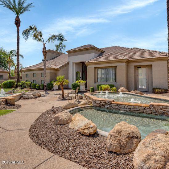 3848 North 3rd Avenue, Unit 1086 Phoenix, AZ 85013 - Photo 35 of 35 a view of a house with swimming pool and a chairs and table in a patio