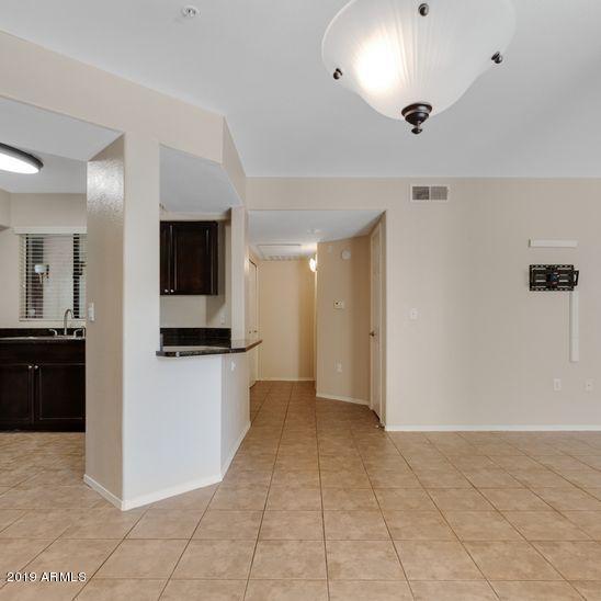 3848 North 3rd Avenue, Unit 1086 Phoenix, AZ 85013 - Photo 5 of 35 a view of a kitchen with a sink and a microwave