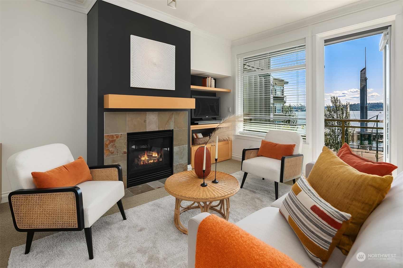 2000 Alaskan Way, Unit 442 Seattle, WA 98121 - Photo 3 of 23 a living room with furniture and a fireplace