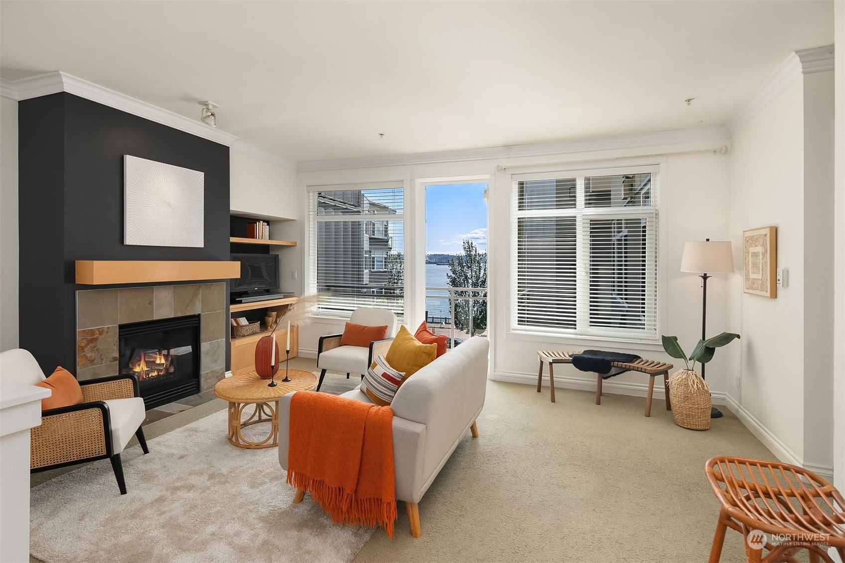 2000 Alaskan Way, Unit 442 Seattle, WA 98121 - Photo 5 of 23 a living room with furniture and a fireplace