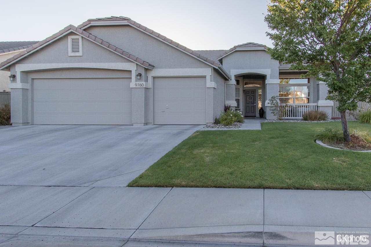 9760 Frankwood Drive Reno, NV 89521 - Photo 1 of 24 a front view of a house with a yard and garage