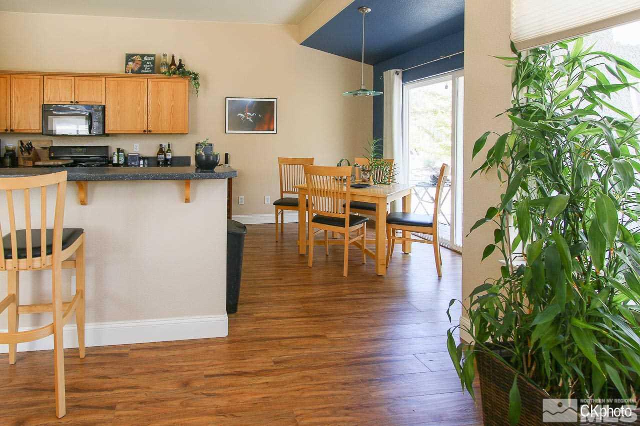 9760 Frankwood Drive Reno, NV 89521 - Photo 14 of 24 a dining room with furniture window and wooden floor